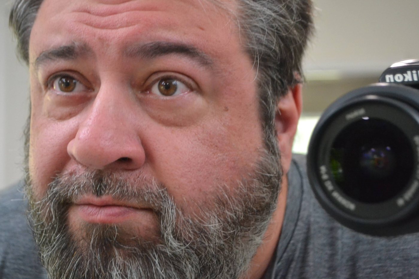 Lucas Shaffer, founder of TCG Partnerz, beside the camera he photographs every card with